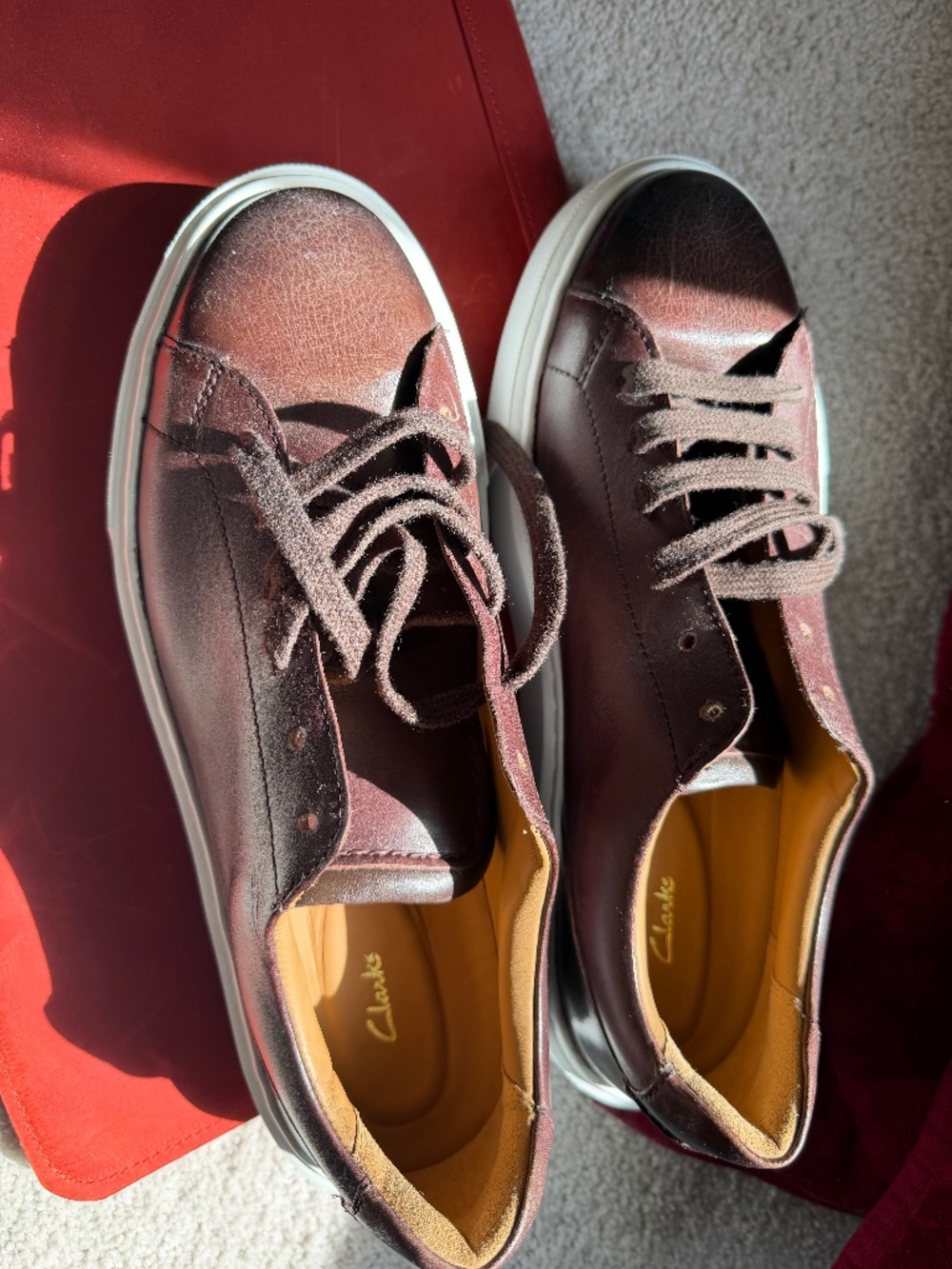 Clark’s brown leather sneakers